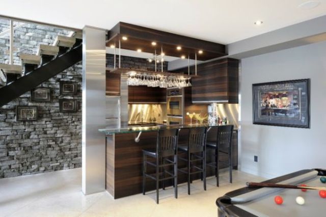 basement bar with a pool table next to it