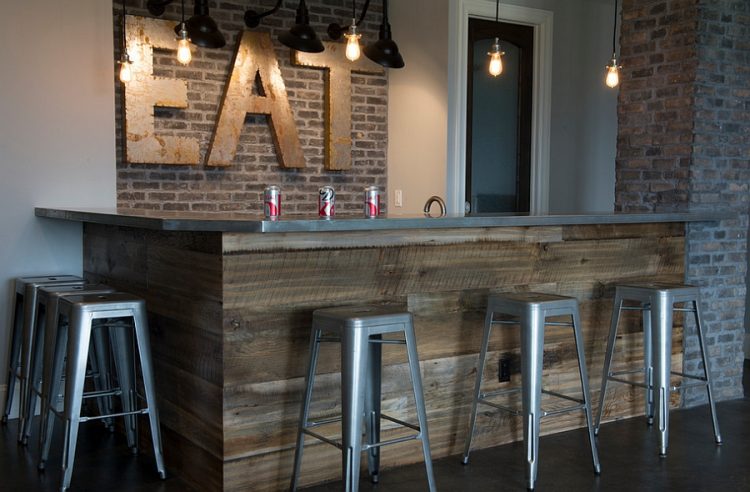 rustic basement bar with reclaimed wood and brick