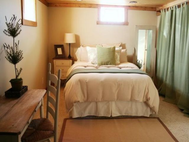 neutral and green basement bedroom