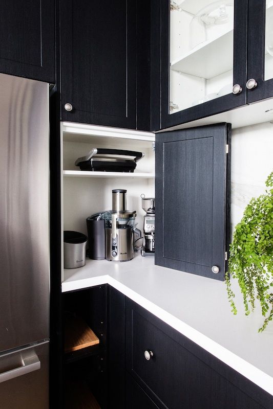 add a folding door to the open space on your countertops to hide kitchen appliances and keep the kitchen look neat and elegant