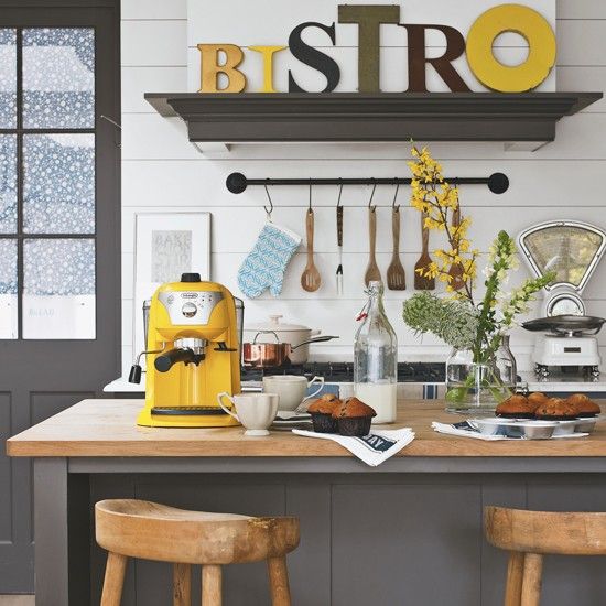 a sunny yellow coffee machine and a matching sign to cheer up the space