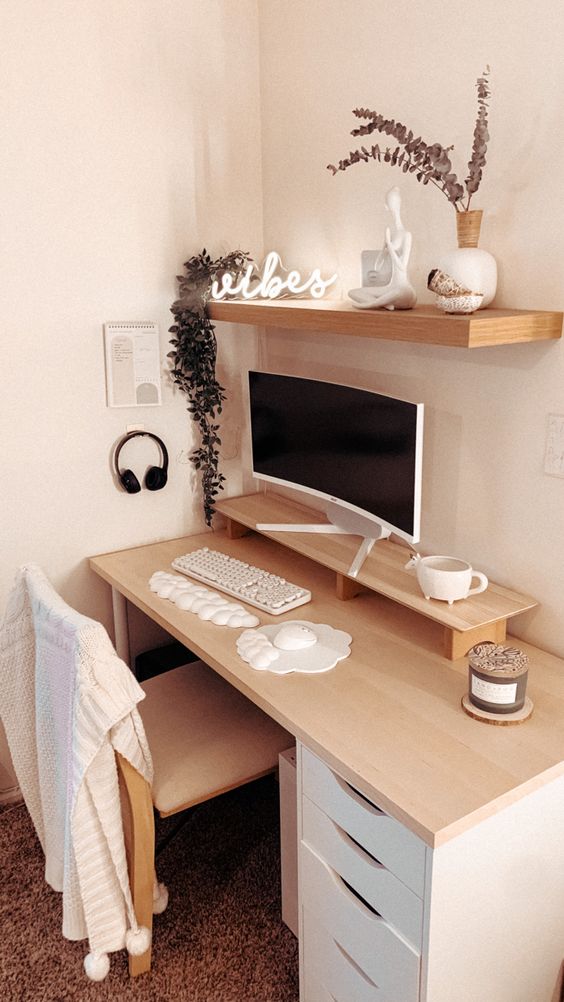 a clean minimal workspace with a desk and a stand, a shelf with decor, a PC, a chair and some devices