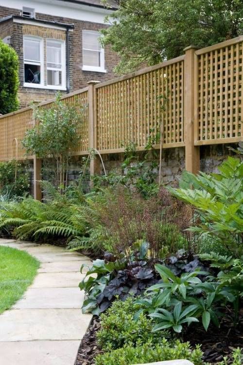 a complicated fence of brick and lattic on top plus greenery along the fence allows some privacy but doesn't look that bulky