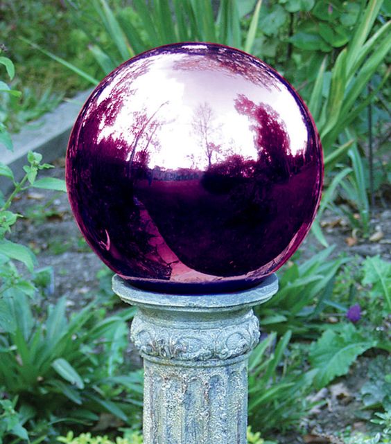 a large purple mirror garden ball on a vintage stand will add color and a shiny touch to your outdoor space, it looks unusual