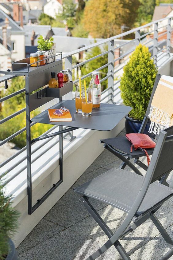 a little and functional metal railing hanging piece can be used for planters, for food and drinks and even for working on a small laptop