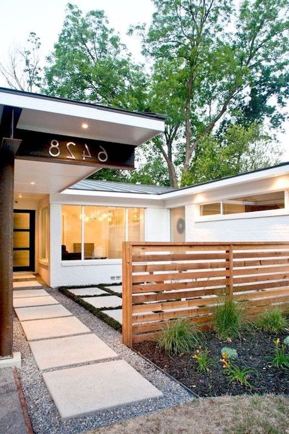 a low light-stained planked fence is great for dividing spaces, though it won't give much privacy