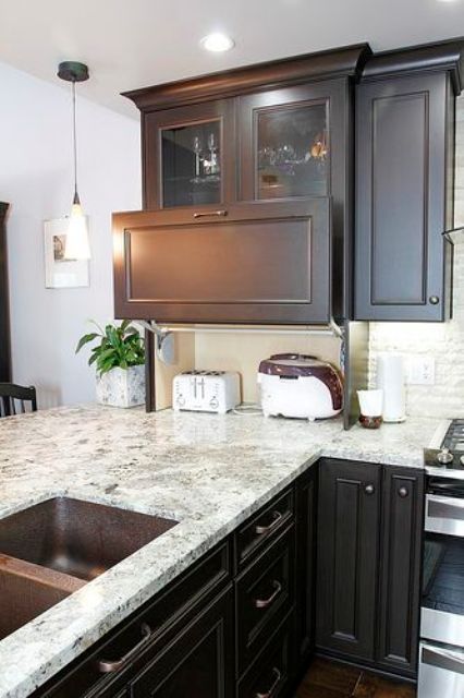 a mini cabinet with sliding doors and various appliances is a cool idea for keeping your kitchen in order