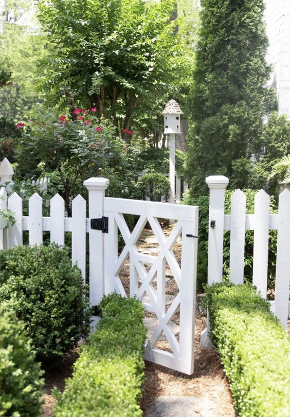 a simple white fence plus a matching gate are always a good idea for a cottage garden, surround them with greenery