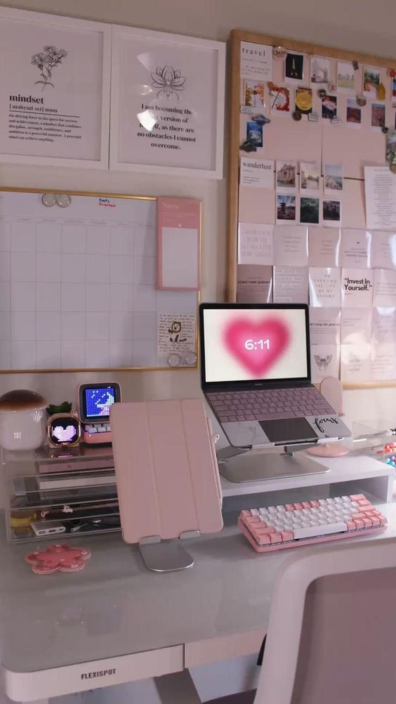 a study space with a laptop on a stand, a stand wih devices and stuff, a large memo board and some other memos on the wall