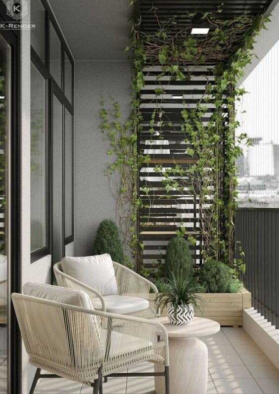 a stylish modern balcony with neutral seating furniture, a side table, potted plants, atrellis with greenery climbing up is amazing