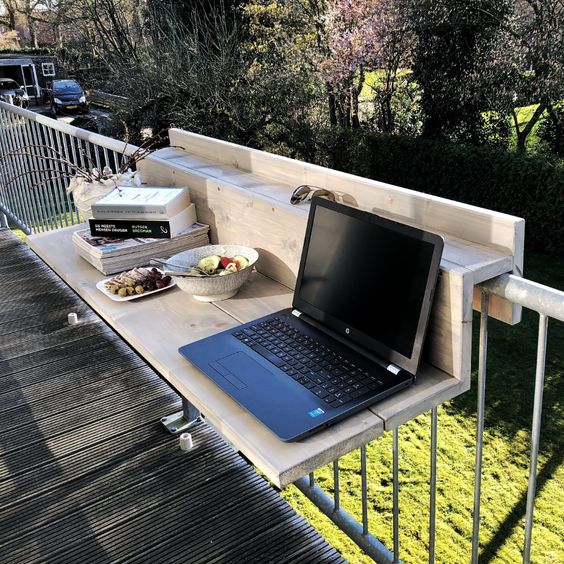 a whitewashed mini railing table is a lovely piece to work in your small balcony or you may use it for food and drinks