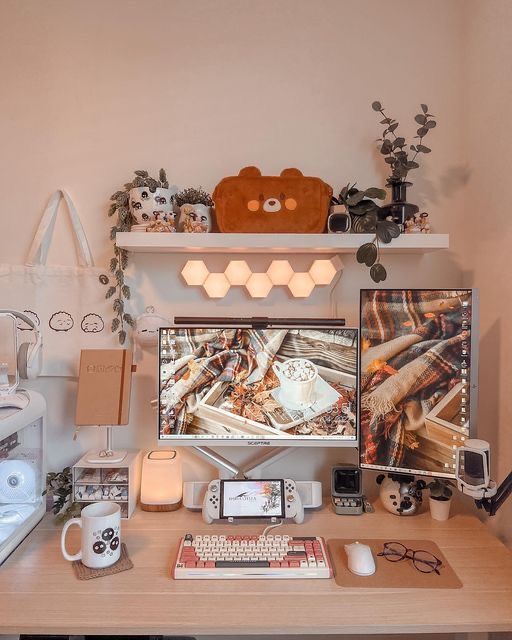 an aesthetic workspace with a desk, some devices, a hexagon wall lamp, a shelf with decor and greenery is amazing