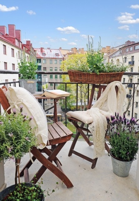 greenery and some blooms in buckets and pots is a great idea to bring a fresh spring feel to any space