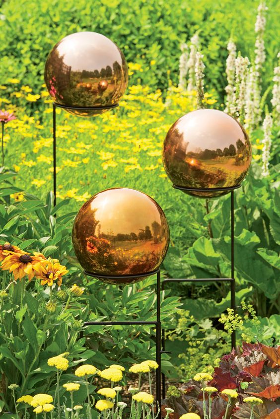 beautiful amber glass spheres on stands will make your garden even brighter and cooler, they add a warm touch of color