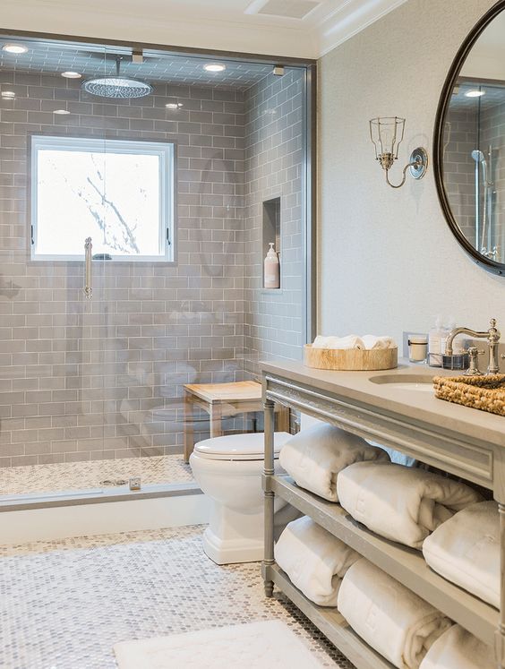 modern grey basement bathroom with a steam room