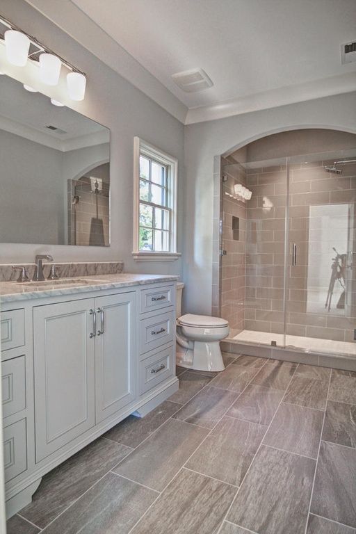 neutral grey and brown basement bathroom