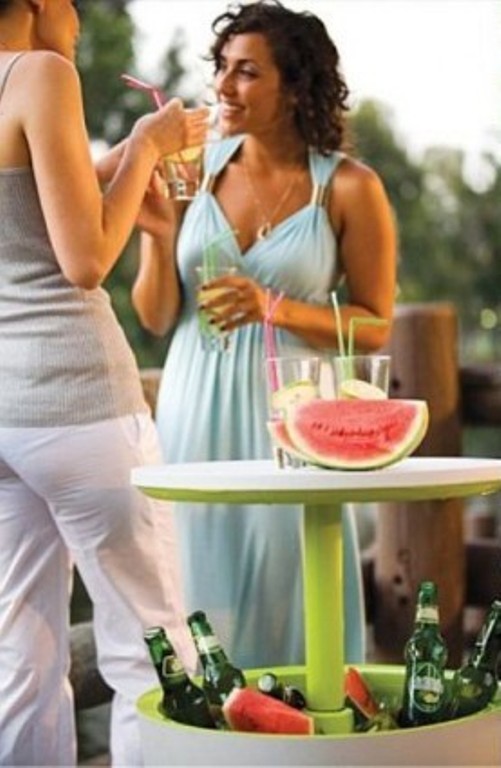 Outdoor Bar With A Table And A Fridge Under It