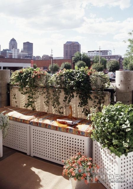 white benches with storage space inside nd colorful cushions on top will fit even a small balcony