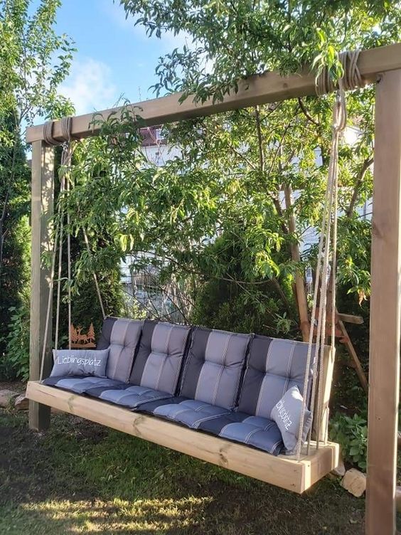 such a swinging sofa can be DIYed, add cushions and pillows and place it in some shady nook