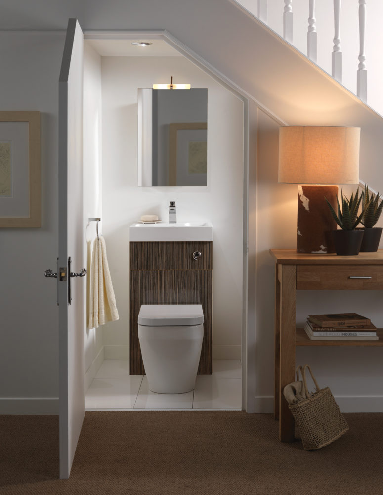 Did you know you could turn an under stairs space into a small bathroom? Just install a cute toilet sink combo and add a mirror above it.