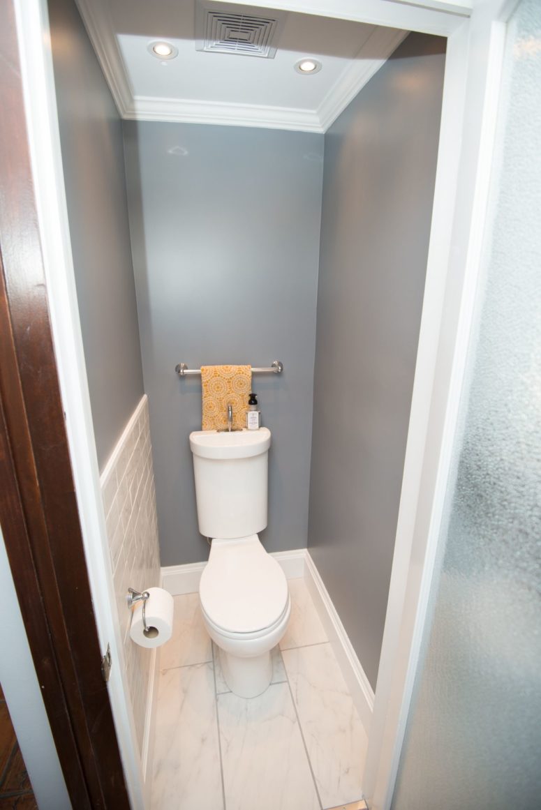 a minimalist powder room that serves its purpose well