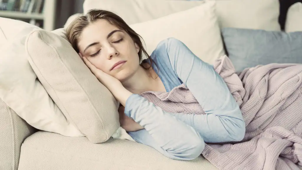 Woman sleeping on couch