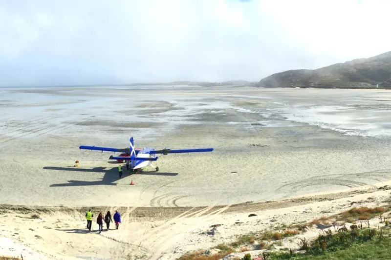 Plane landing on the beach at Barra Airport