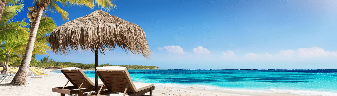 Caribbean Palm Beach With Wooden Chairs And Straw Umbrella - Idyllic Island