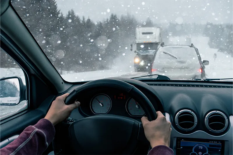 POV of a person driving in a blizzard