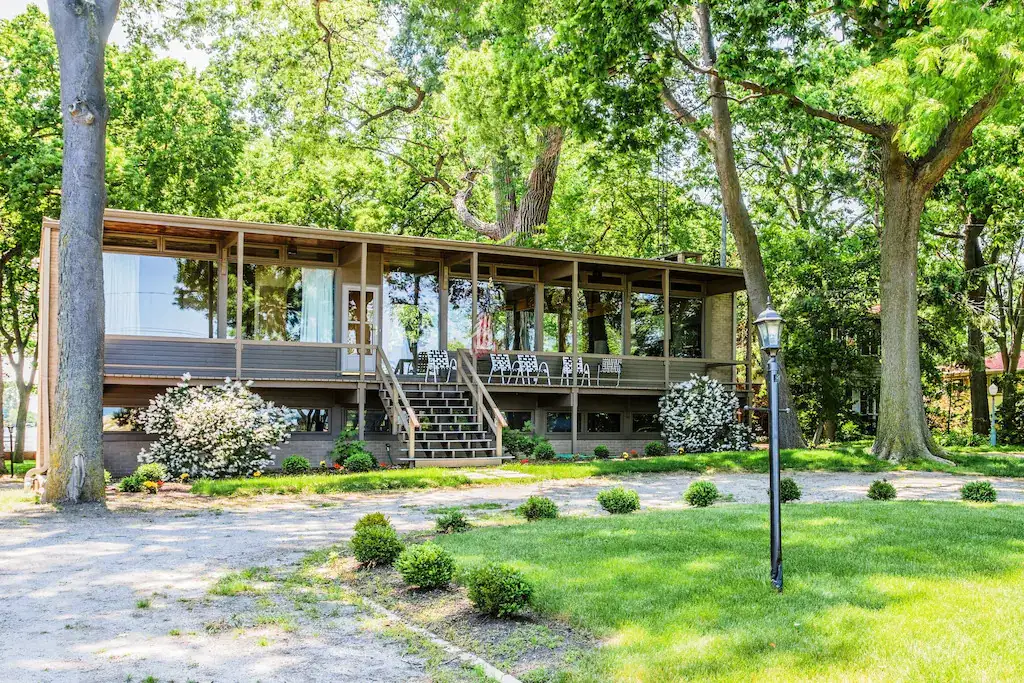 Modern house with wall of glass windows in front