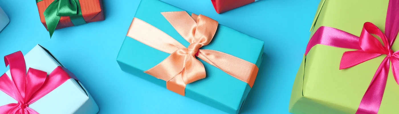 Flat lay composition with beautiful gift boxes on color background