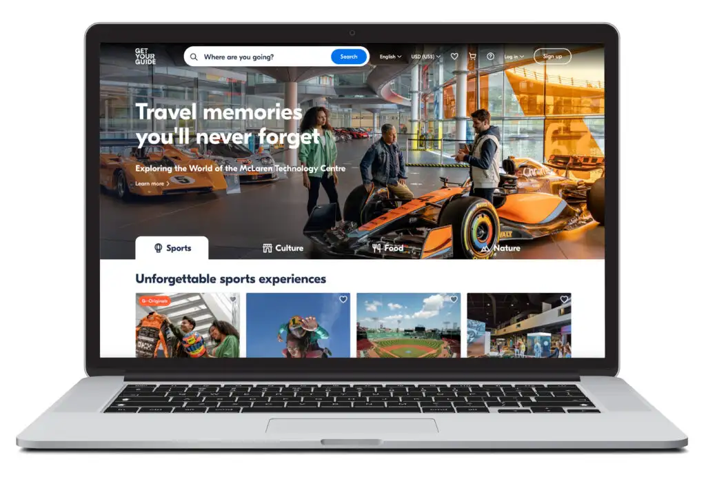 Laptop showing the homescreen of GetYourGuide, a ticket and excursion booking website