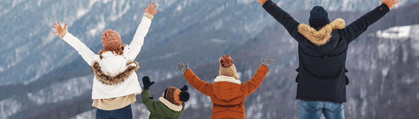 happy family mother father and children on winter nature