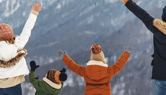 happy family mother father and children on winter nature