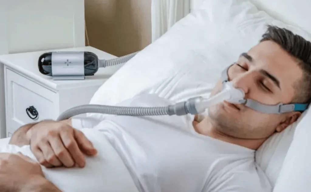 Man Sleeping with CPAP