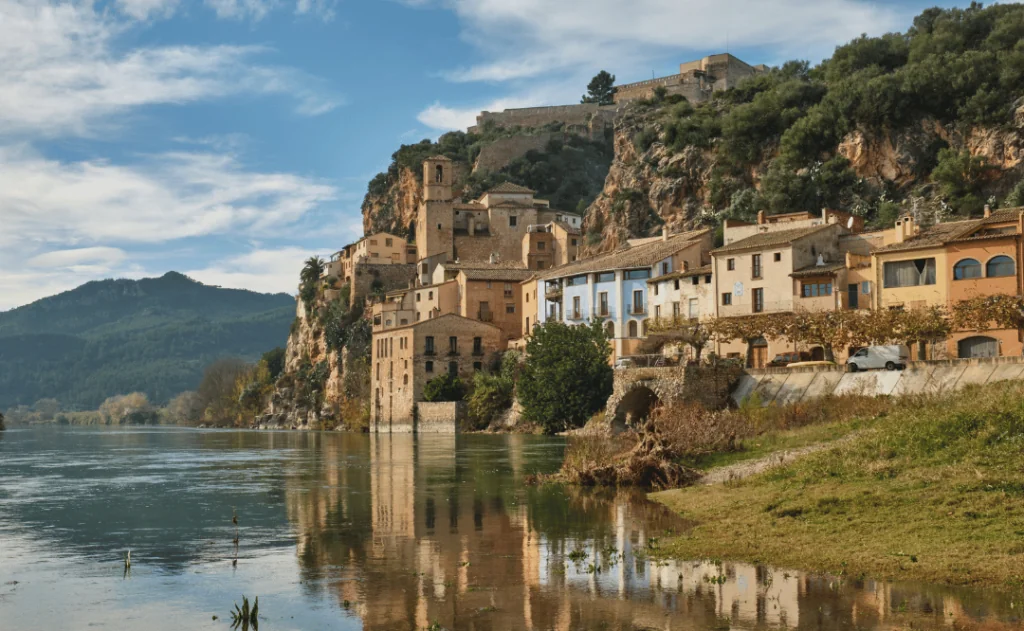 Miravet village and its Templar castle on top of the hill on the banks of the Ebro river, Tarragona, Spain