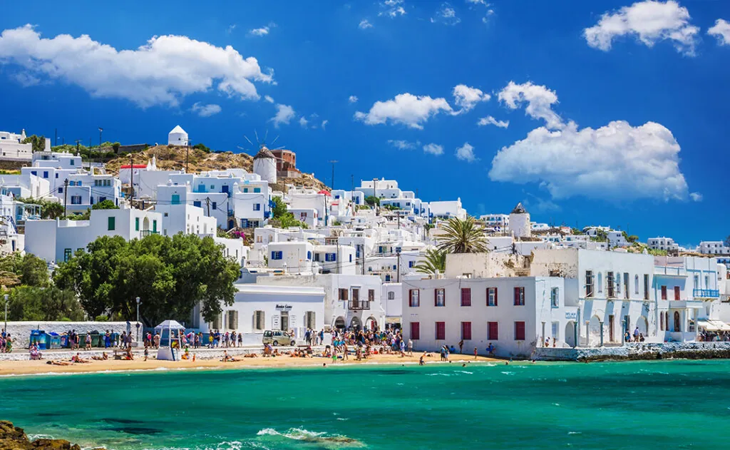 MYKONOS, GREECE - JULY 4, 2017: Beautiful view of Mykonos town in Cyclades Islands. There are white houses and boats in the old harbor.