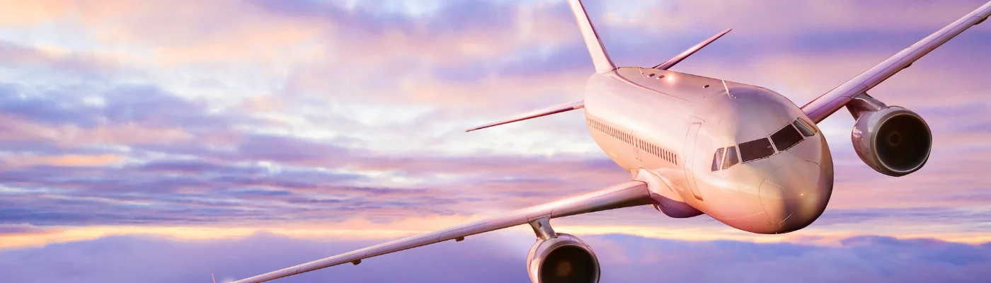 Passengers commercial airplane flying above clouds