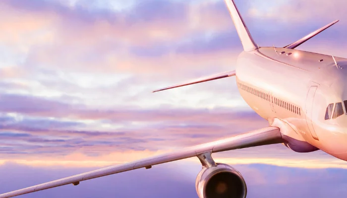 Passengers commercial airplane flying above clouds