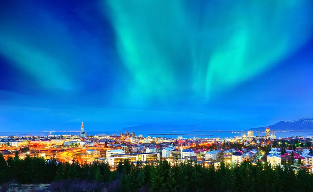 View of the northern light from the city center in Reykjavik, Iceland.