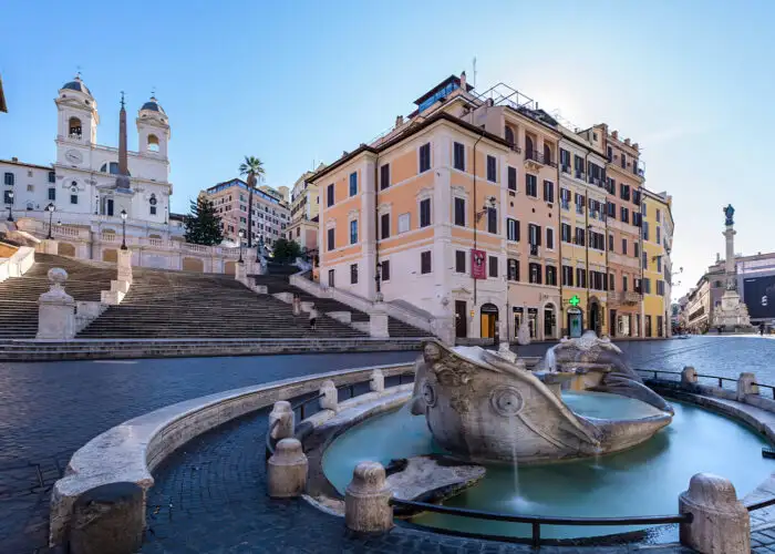 Two foreign tourists take pictures on the Spanish Steps, Rome, Italy. Popular tourist sites have been deserted following the nnationwide coronavirus pandemic lockdown.