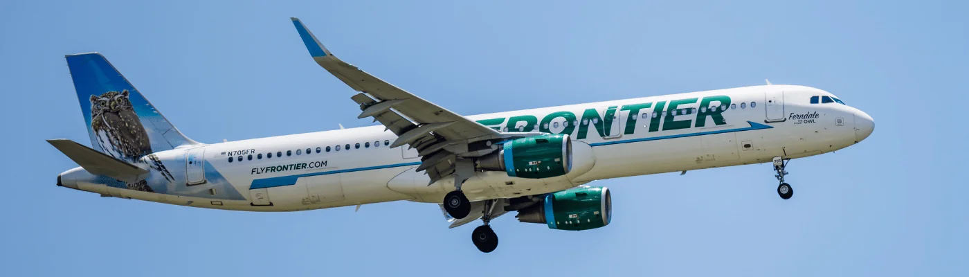 ORLANDO, FLORIDA - JUNE 29, 2022 : Frontier Airlines Airbus A321 commercial jet airplane in flight shortly before landing at the Orlando International Airport (MCO). Ferndale the Pygmy Owl jet plane.