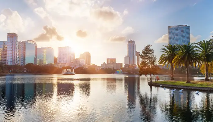 Sunset at Orlando in Lake Eola Park with water fountain and city skyline, Florida, USA