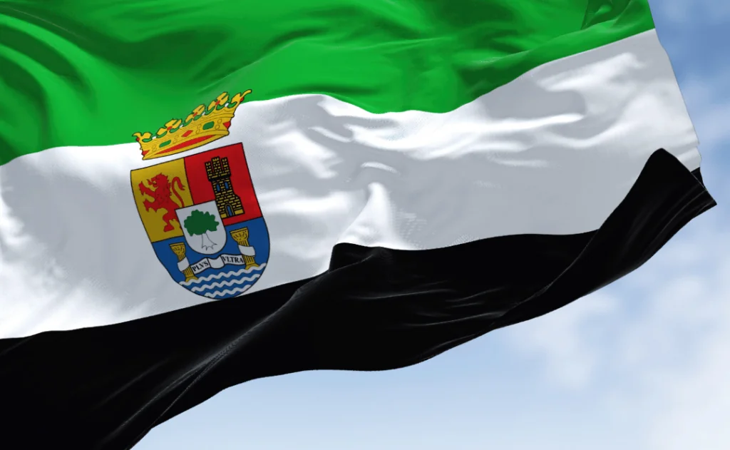 The Extremadura flag waving in the wind on a clear day