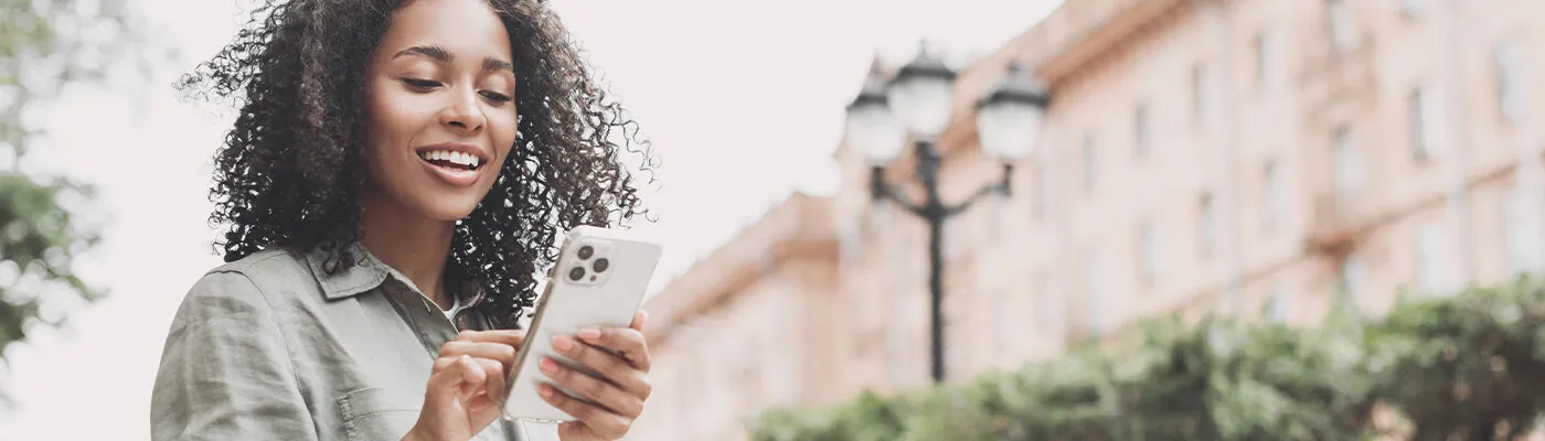 Woman using phone to navigate city